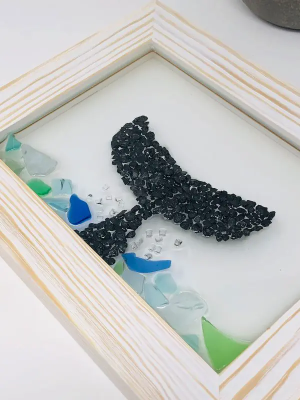 hand crafted black pebble whale tale resin wall art