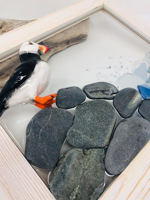 handmade puffin wall decor with pebbles and sea glass
